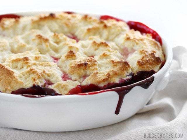 Baked lemon berry cobbler served in a dish.