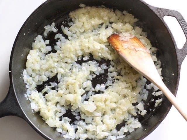 Onions and Garlic Sautéed in a Cast Iron Skillet