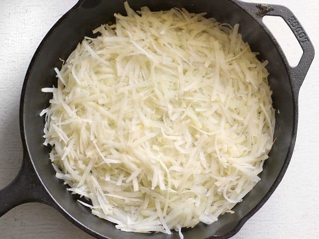 Potatoes in Hot cast iron skillet 