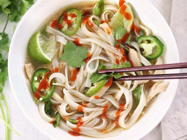 Close-up of quick faux pho served with chopsticks.