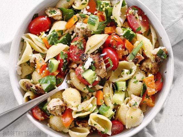 Close-up of Greek chicken pasta salad in a bowl.