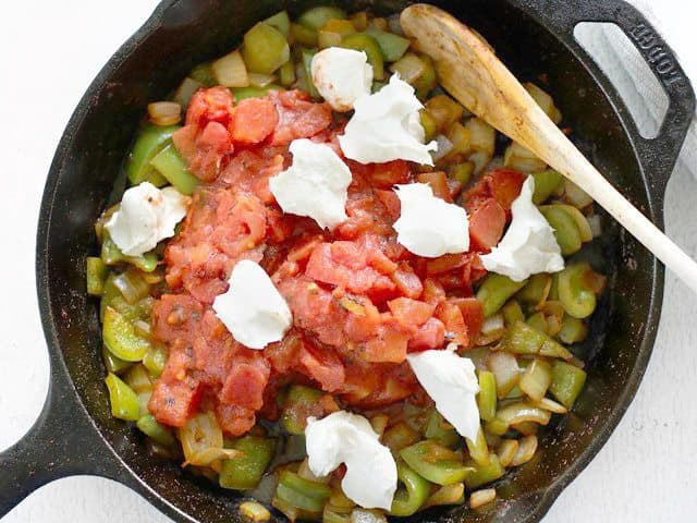 Add Tomatoes and Cream Cheese in skillet