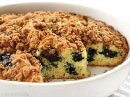 Open blueberry buttermilk coffee cake on a serving plate.