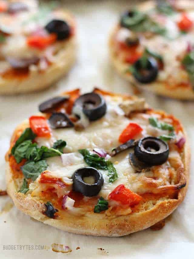 Close up of baked Freezer Ready Mini Pizzas on a baking sheet.