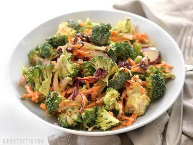 Side view of a bowl full of Broccoli Salad with Honey Yogurt Dressing 