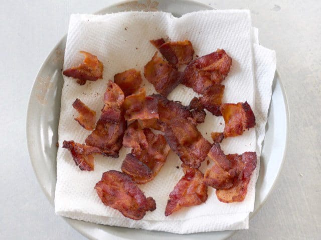 Cooked Bacon bits on paper towel 