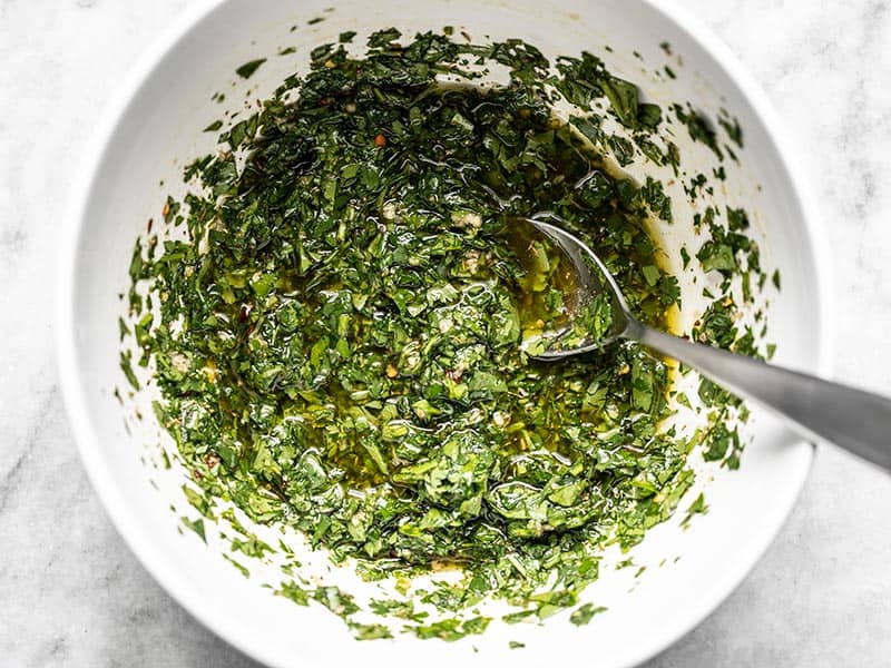 Chopped herbs stirred into olive and oil mixture.