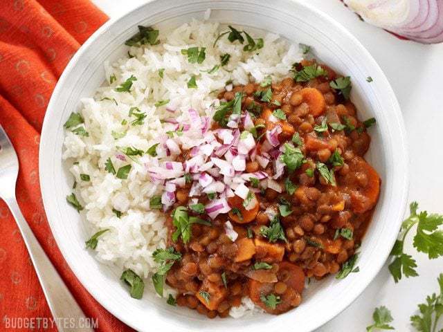 Close-up of coconut curry lentils in a bowl.