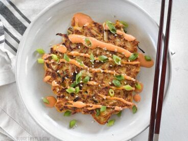 Savory Cabbage Pancakes are a fun and filling way to use up pantry leftovers. Fill them and top them with whatever your heart desires! BudgetBytes.com