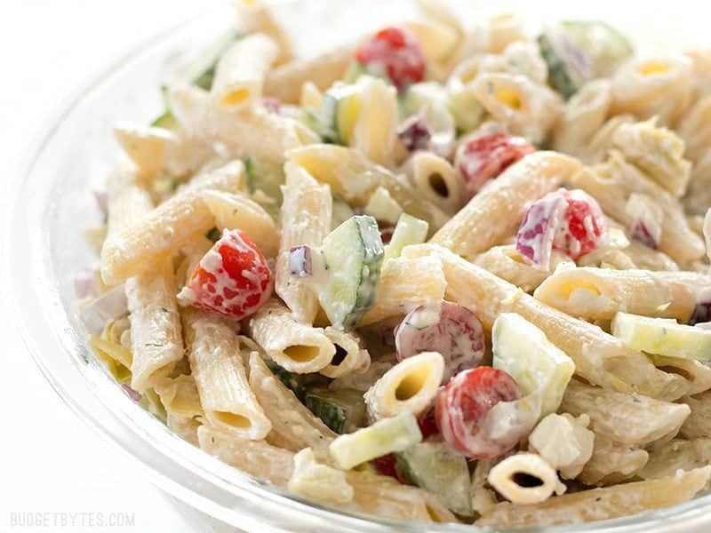 Side view of Creamy Lemon Dill Greek Pasta Salad in a glass bowl