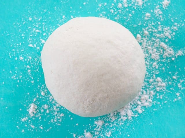 Smooth Kneaded Dough on a blue cutting board