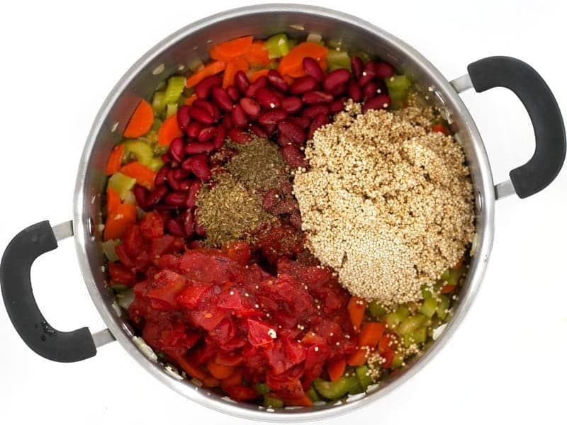 Add Quinoa Beans Tomatoes and Spices to the pot