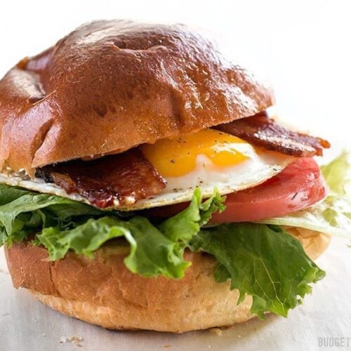 Brown sugar bacon breakfast sandwich on a plate.