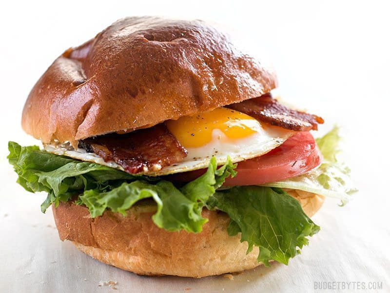 Brown sugar bacon breakfast sandwich on a plate.