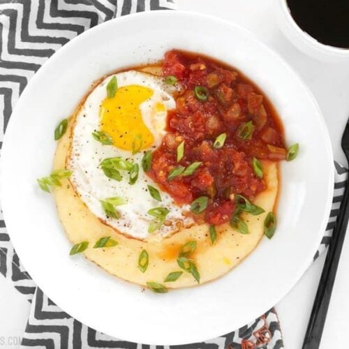 Cheddar grits breakfast bowl served with toppings.