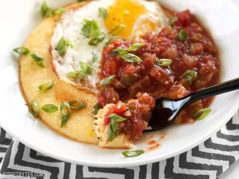 Close up of a bite of Cheddar Grits Breakfast Bowl