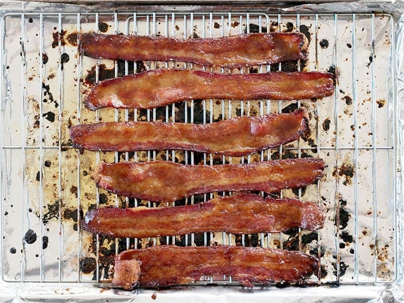 Cooked Brown Sugar Bacon on the baking sheet