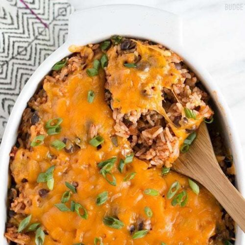 A spoonful of beef burrito casserole in a dish.