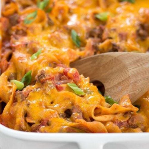 Close-up of a beef and mushroom casserole topped with golden breadcrumbs in a baking dish.