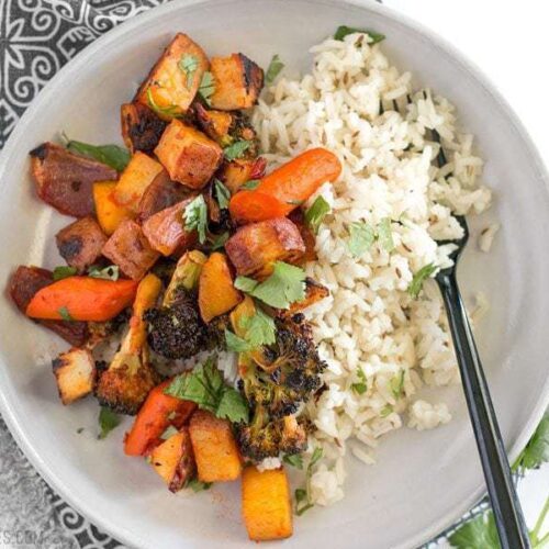 Harissa roasted vegetables served over rice.