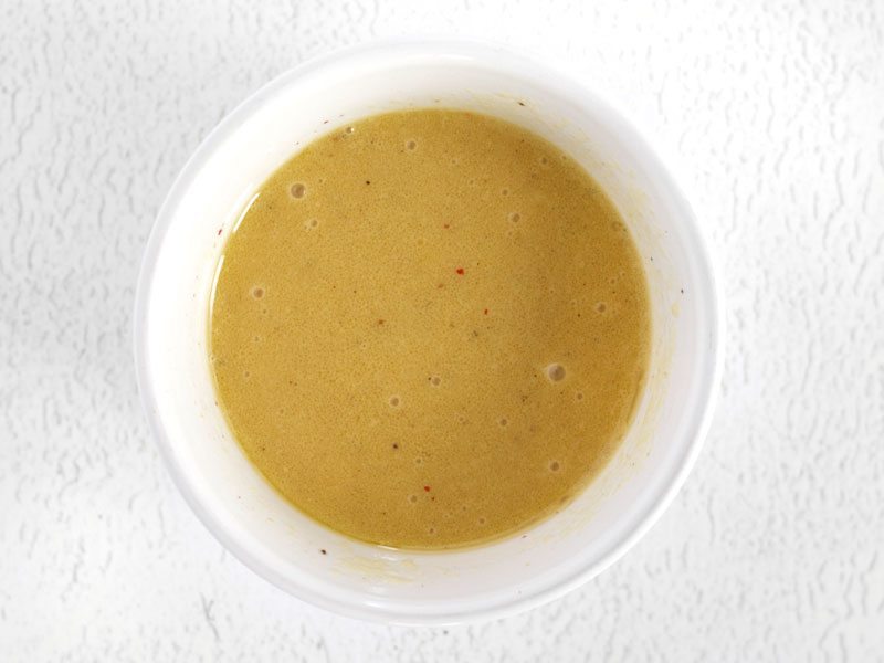 Homemade Dijon Vinaigrette in a small bowl