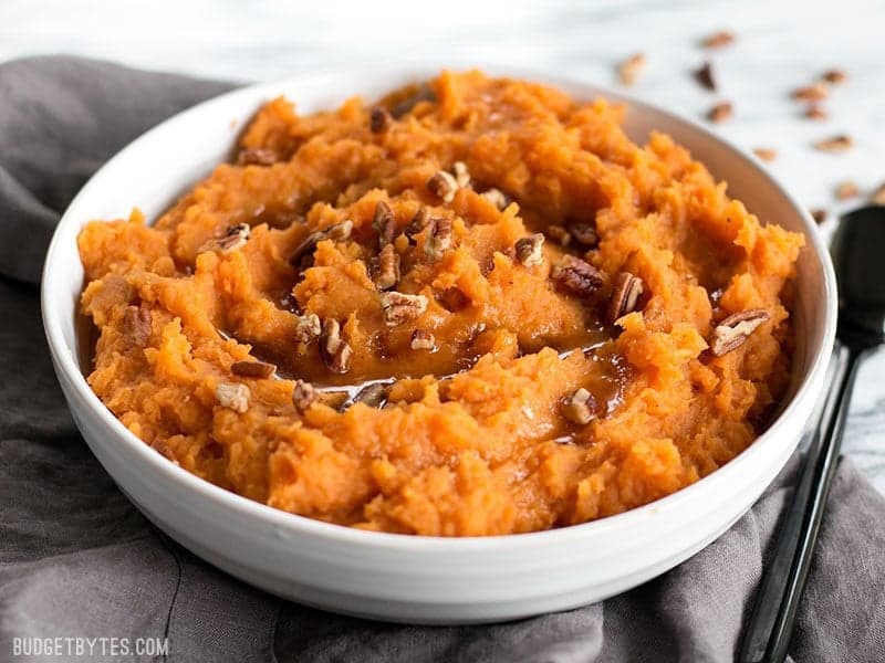 Front view of Maple Brown Butter Mashed Sweet Potatoes with pecans.