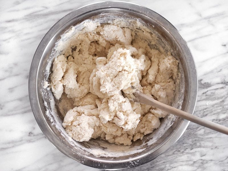 Rough Biscuit Dough in the bowl with a wooden spoon