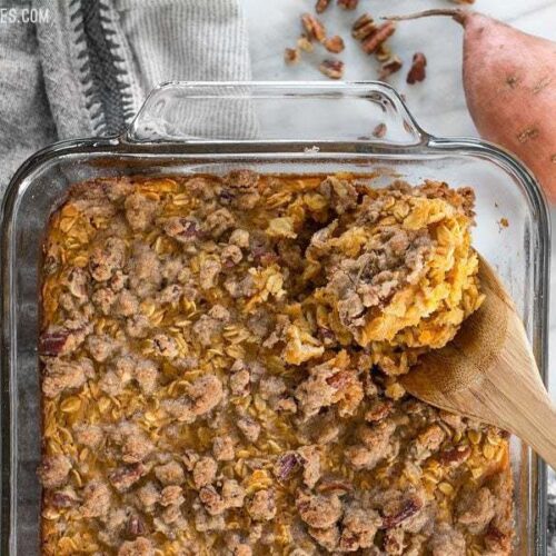 Sweet potato casserole baked oatmeal in a bowl being scooped.