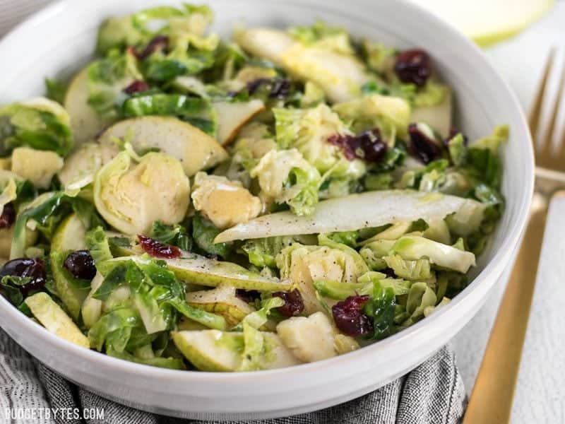 Close up of Warm Brussels Sprouts and Pear Salad in the bowl, from the front