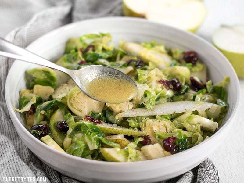 Warm Brussels sprouts and pear salad in a bowl.