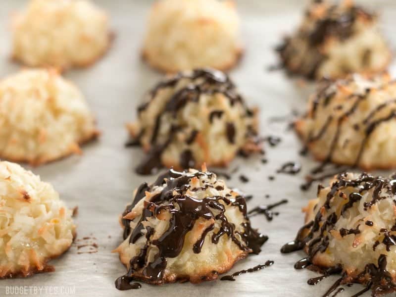 Chocolate Glazed Orange Macaroons half drizzled on the baking sheet