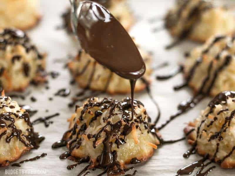 Close up shot of Chocolate being drizzled over a Chocolate Glazed Macaroon.