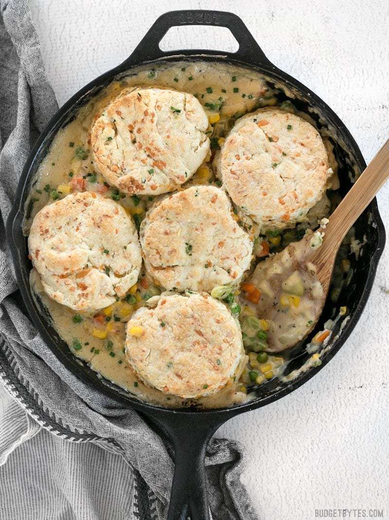 Skillet full of warm and comforting Vegetable Pot Pie Skillet with Cheddar Biscuit Toppings