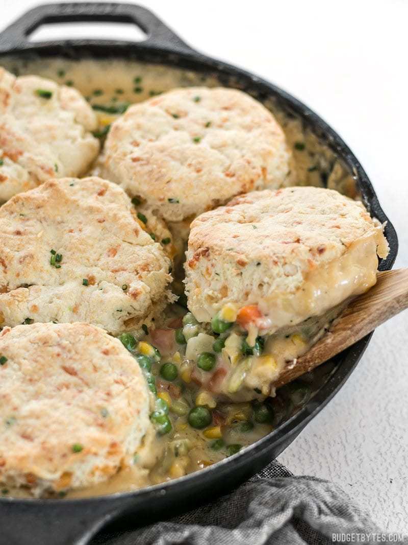 Side shot of the Vegetable Pot Pie Skillet with a scoop of Cheddar Biscuit Topping