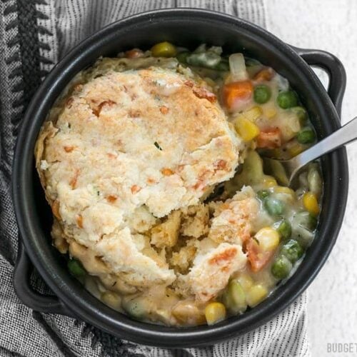 Vegetable pot pie skillet served in a ceramic cookware.