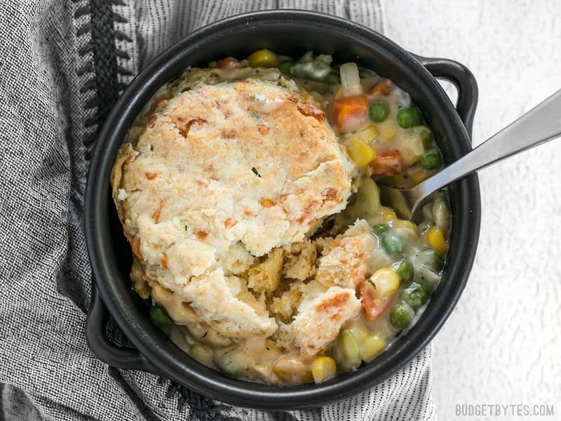 Vegetable pot pie skillet served in a ceramic cookware.