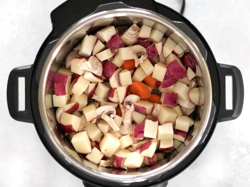 Add Vegetables to the Instant Pot with Beef and Broth