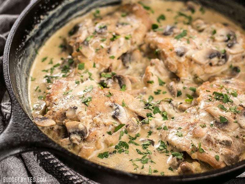 Close up side view of Creamy Garlic Mushroom Chicken in the skillet