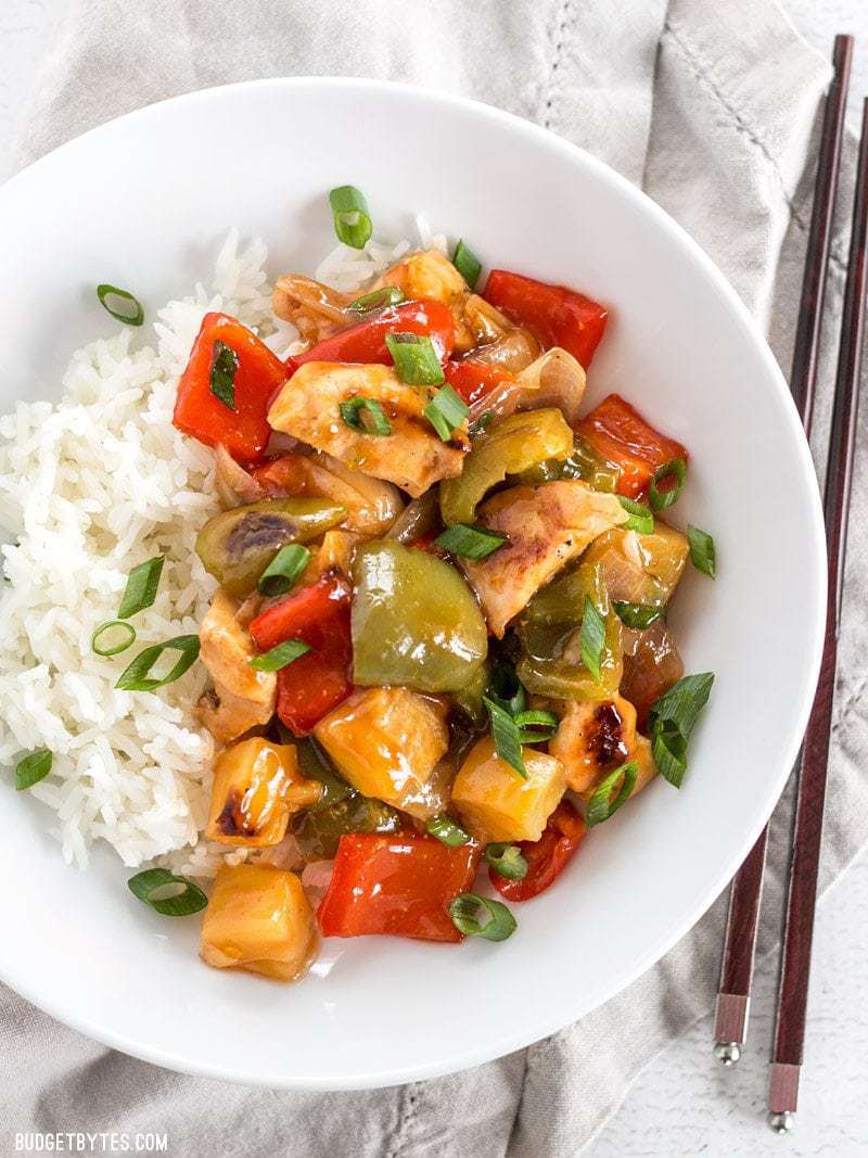 This oven baked Sheet Pan Sweet and Sour Chicken is a little more forgiving than a fast moving, high heat stir fry, making it great for beginners! BudgetBytes.com