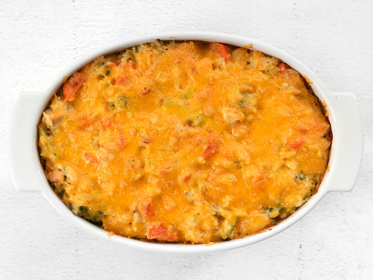 Baked chicken and rice casserole with cheese on top.