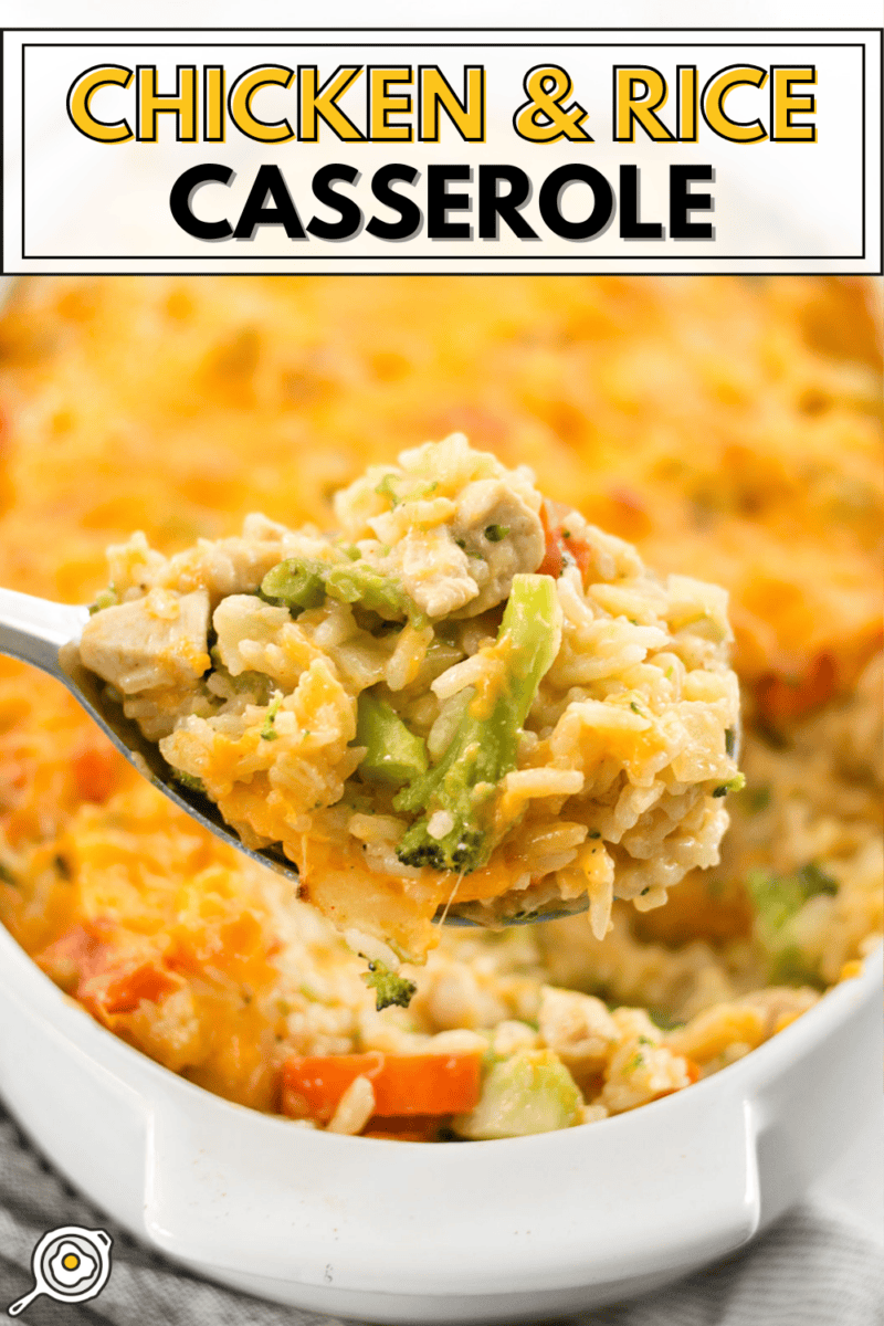 Close up of a scoop of chicken and rice casserole coming out of the dish.