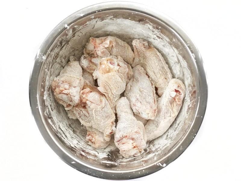 Chicken Wings Coated in Cornstarch in a bowl