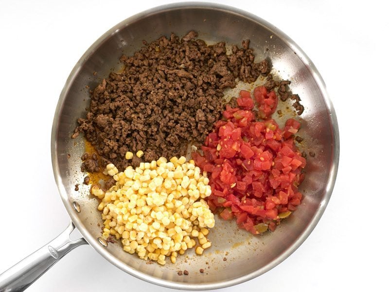 Browned beef, Diced Tomatoes with Chiles, and Corn in the skillet