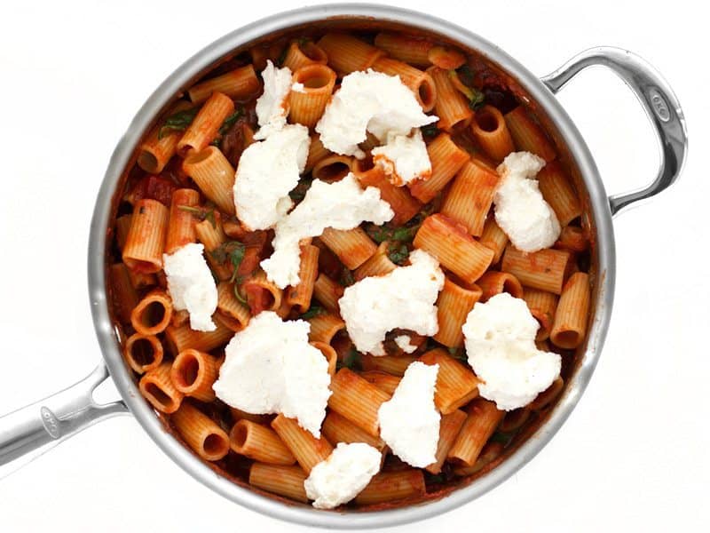 Dollops of Ricotta Mix on top of the pasta and sauce in the skillet