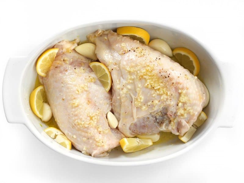 Marinated Chicken Breast in the casserole dish with lemon and garlic, Ready to Roast