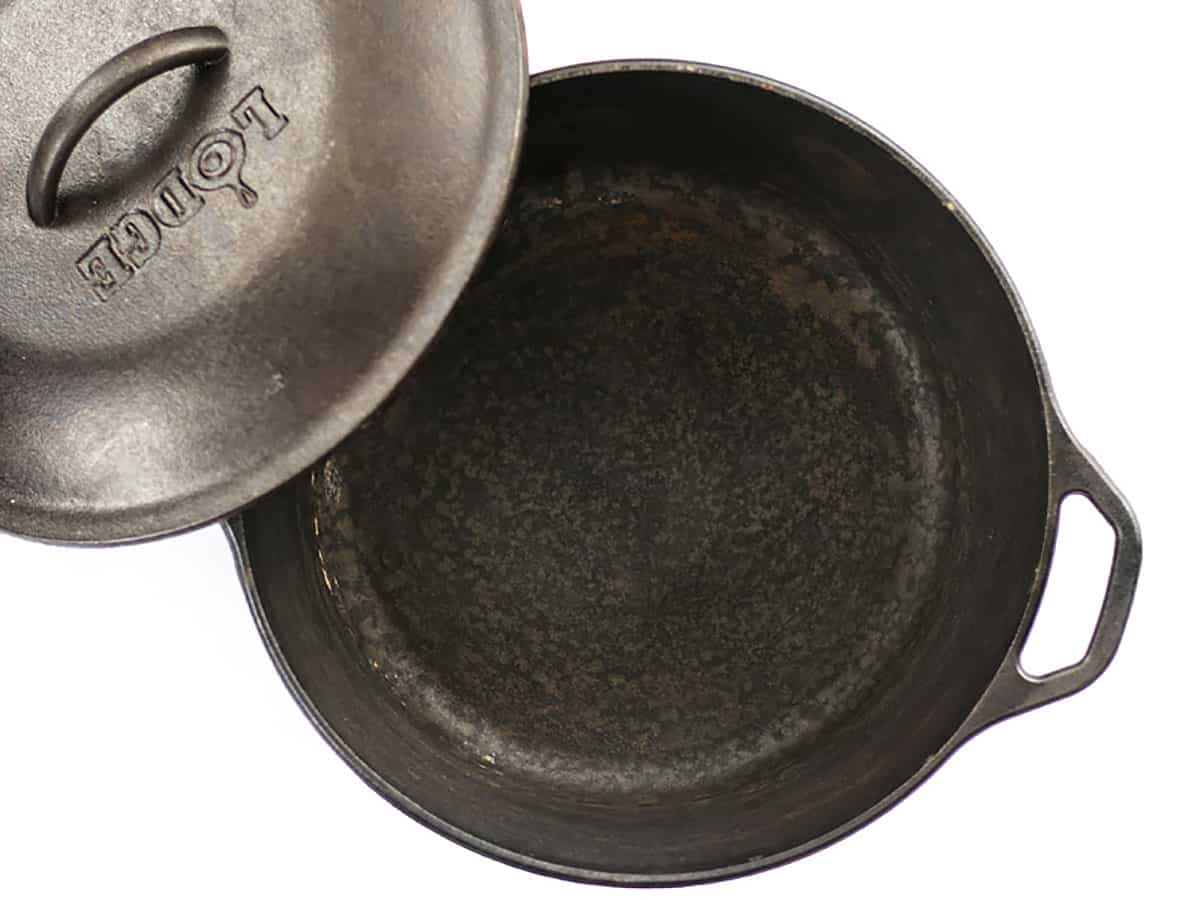 An open cast iron Dutch oven. 