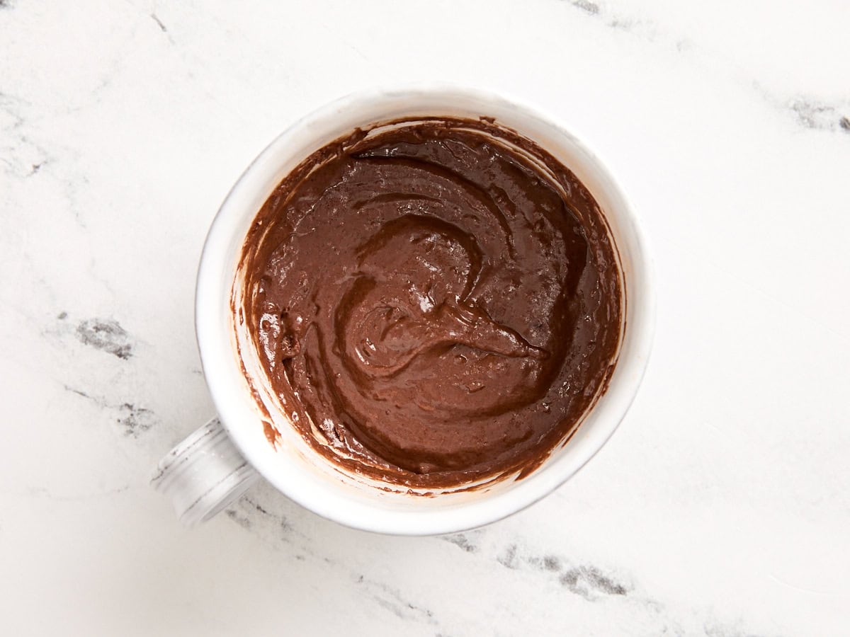 Chocolate mug cake batter in a mug.