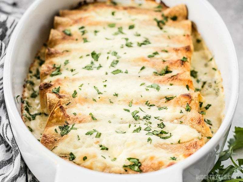 Front view of the casserole dish of Spinach White Bean Enchiladas