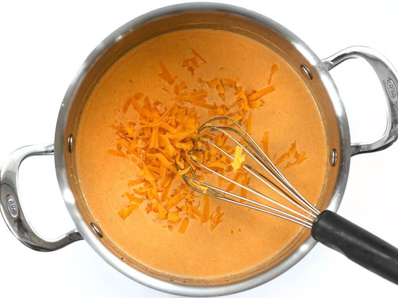 Melt Cheddar into the sauce