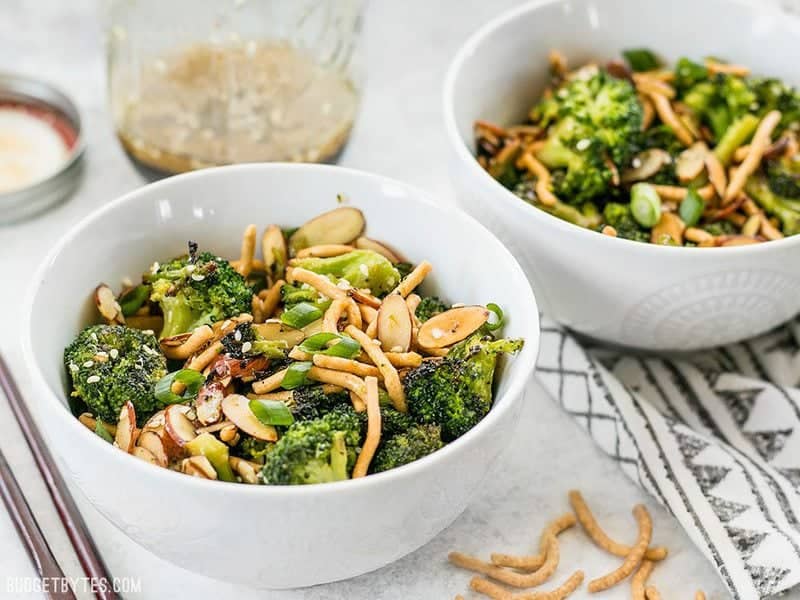 Side view of two bowls of Roasted Broccoli Salad with Almonds 